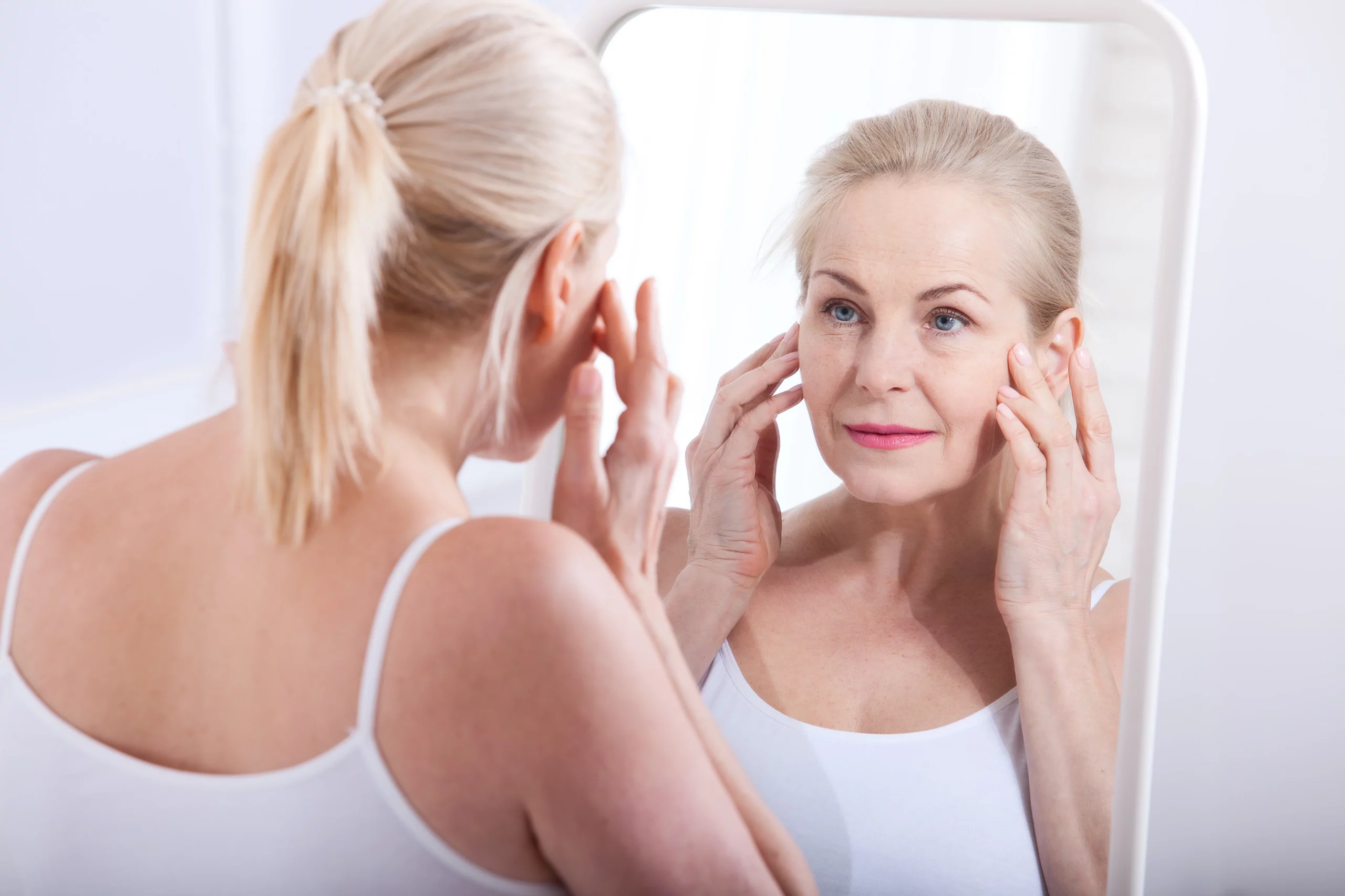 Woman see mirror for Wrinkle Treatment in Draper, UT